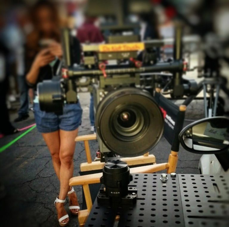 Matthews Studio Equipment Cine Gear Expo 2015 Girl on Cell Phone With Camera Photo by Socialbilitty 768x759